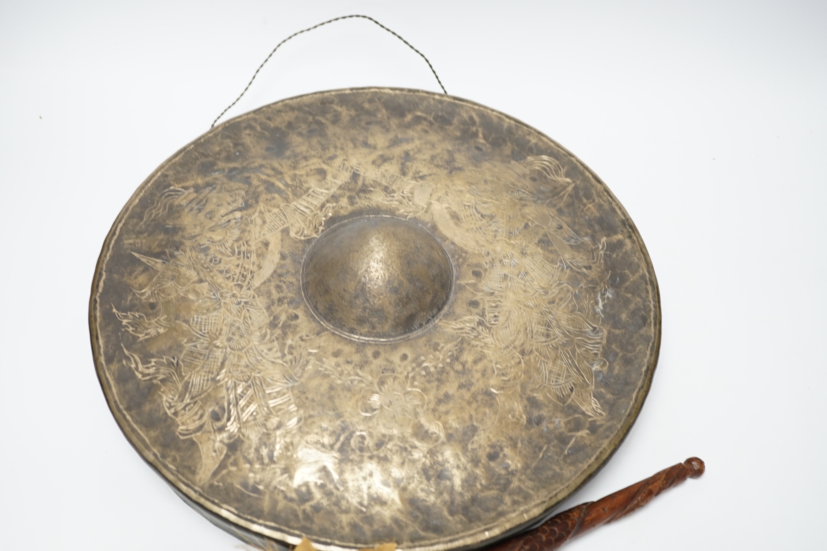An Indonesian silver plated gong and beater, gong 33cm diameter
